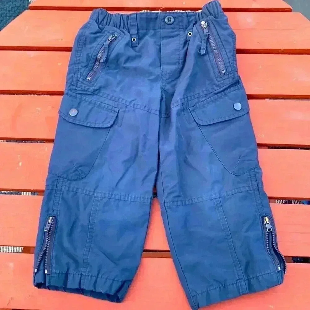 Gap, fully lined cargo style rain pants with zippers at the cuffs